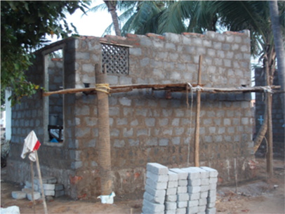 One of the eight brick houses currently under construction