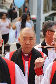 Bishop Koo waits with fellow Bishops