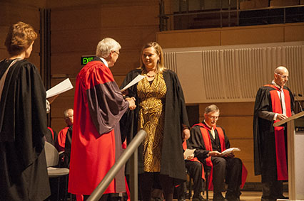 Graduate Renee Brasier receiving her Diploma of Bible and Missions from Archbishop Peter Jensen